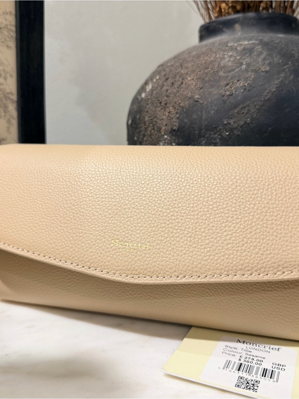 Moncrieff Beige Pebbled Leather Clutch